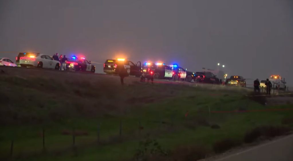 Police respond to the scene of the shootout on Interstate 5.